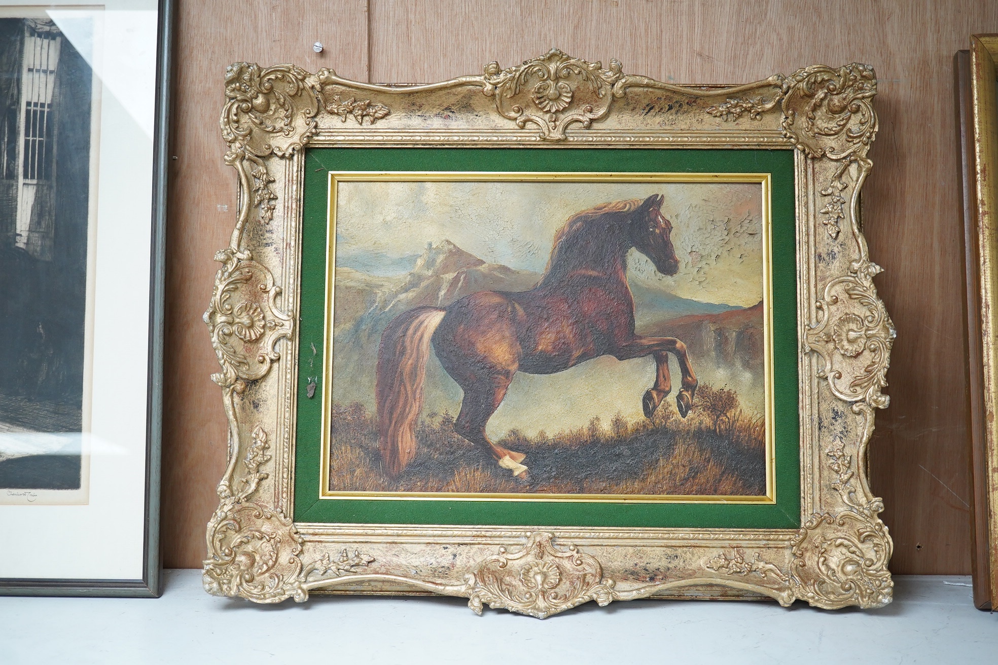 19th century style oil on board, Study of a rearing horse before a landscape, unsigned, 24 x 34cm, ornate gilt framed. Condition - poor